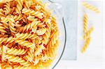 Wholemeal fusilli in a measuring jug (view from above)