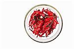 Dried red chillies in a glass bowl