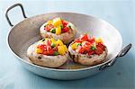 Mushrooms stuffed with tomatoes, yellow peppers and peas