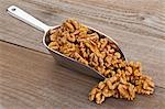 Walnuts on a metal scoop