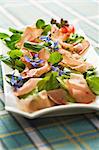 Styrian Vulcano ham on a bed of lamb's lettuce with balsamic vinegar