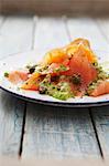 Salmon carpaccio with mustard sauce, capers and dill