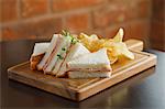 Ham sandwiches with crisps