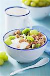 Crunchy muesli with yogurt, kiwis and green grapes