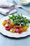 cherry tomatoes and arugula with dill and sesame seeds