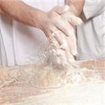 Professional Bakery - Baker Working with Dough.