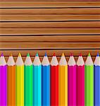Illustration palette pencils on wooden background - vector