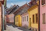 Street with colorful houses in Sighisoara, Romania