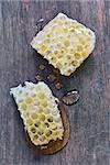 Honeycomb on a vintage wooden background