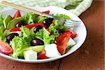 Mediterranean salad with black olives, lettuce, cheese and tomatoes