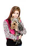 attractive young girl with long blonde hair wearing pink dress with her best friend yorkshire terrier isolated white background