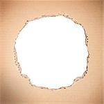 White circle shape breakthrough in beige cardboard