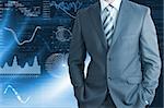 Businessman in a suit with background of graphics. Business concept