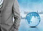 Businessman in a suit with background of Earth and graphics. Business concept