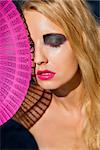 young beautiful woman with smokey eyes and pink lips portrait makeup