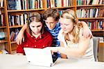 Students using laptop computer in the library.