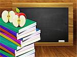 Blackboard, school books and apples on wood background.