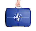 Used plastic suitcase with stains and scratches, printed with flag, NATO