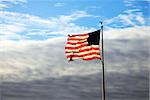 USA Flag on pole waving in the wind