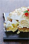 tart with lemon cream and meringue decorated with currants