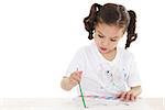 Stock image of female preschooler playing with watercolors over white background