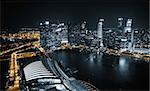 Aerial view of Singapore at night with traffic