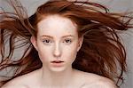 Portrait of young woman, windswept hair