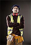 Portrait of serious worker in reflective clothing