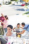 Portrait of smiling woman shopping at yard sale