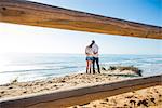 Romantic young couple on beach, Torrey Pines, San Diego, California, USA