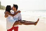 Couple kissing on Arpoador beach, Rio De Janeiro, Brazil