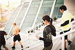 Small group of runners training on convention center steps