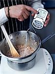 Heating the mixture in a bain-marie up to 65