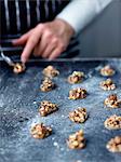 Placing small heaps of the mixture on the baking tray