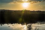 Fishermen in their canoes fishing at sunset on the Nile at Jinja, source of the Nile, Uganda, East Africa, Africa