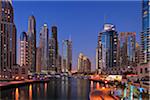 Skyscrapers at Dubai Marina illuminated at Dusk. Dubai, United Arab Emirates