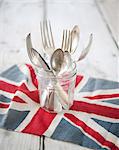 Cutlery in a jar on an English flag