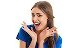 Surprised ecstatic young beautiful woman shouting of joy over white background.