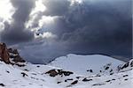 Snowy mountains and storm clouds. Turkey, Central Taurus Mountains, Aladaglar (Anti Taurus) view from plateau Edigel (Yedi Goller)