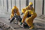 Man in chemical protection suit, carrying out the decontamination area