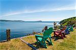 Colorful lounge chairs with a view of beautiful scenic panorama  (Cape Breton Highlands National Park, Canada)