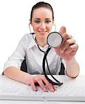 Businesswoman typing on a keyboard and holding stethoscope on white background