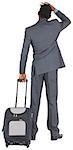 Young businessman standing with suitcase on white background