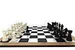 Black and white chess pieces on board on white background