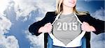 Businesswoman opening shirt in superhero style against blue cloudy sky