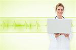 Blonde doctor using laptop against medical background with green ecg line