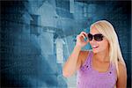 Blond woman with sunglasses against airport departures board for america