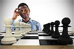 Composite image of thinking casual businessman with chessboard