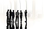 Composite image of business colleagues standing against in large room overlooking city