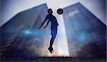 Football player in blue jumping against low angle view of skyscrapers